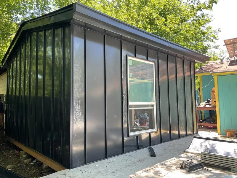 Black standing seam metal wall panels for Roof Inspection in Slidell