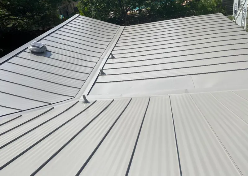 Solar attic fan installed on a metal roof for Roof Ventilation in Slidell